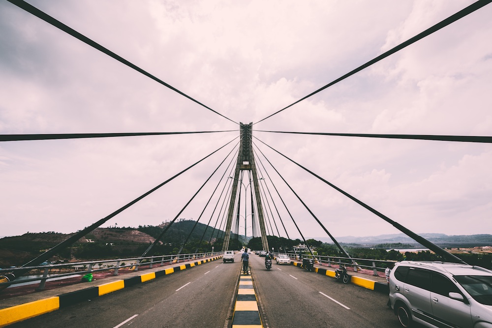 An impressive suspension bridge as seen while driving on it.